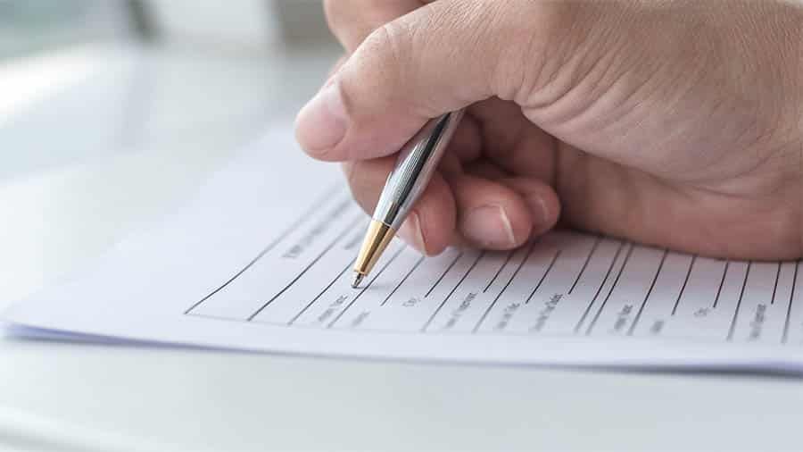 Hand Signing a Document